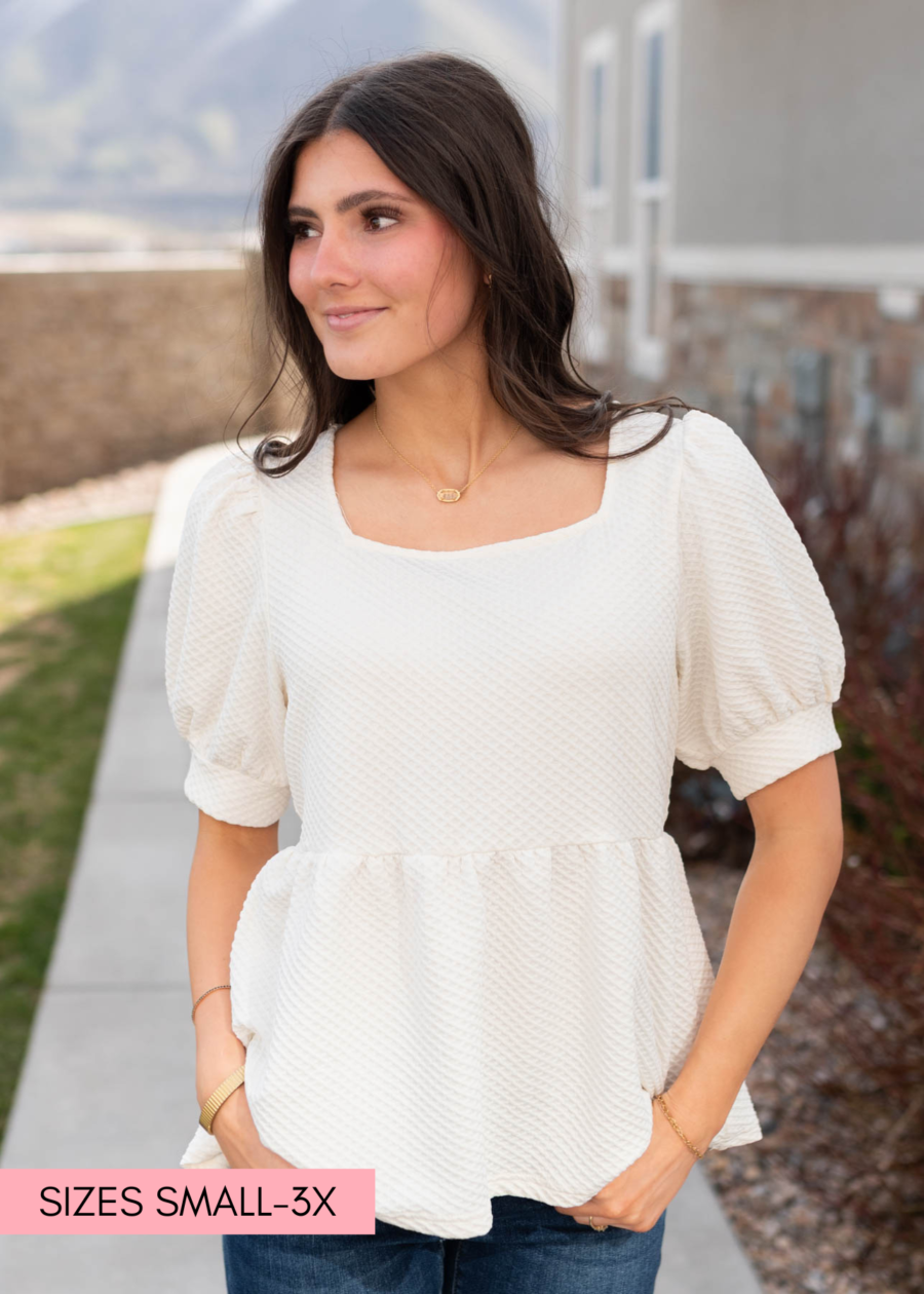 AngelinaCreamRuffleTop_e7f48888-d951-44be-b63b-83e0fd61be76.png Angelina Cream Ruffle Top